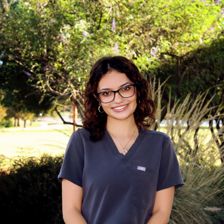 Renee - Technician women standing outside and smiling