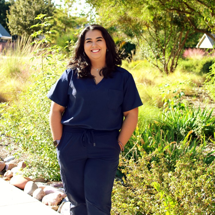 Shoshana - Technician Women standing outside