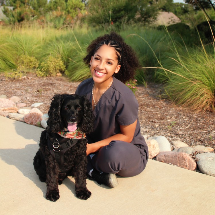 Taleah - Technician women sitting with pet